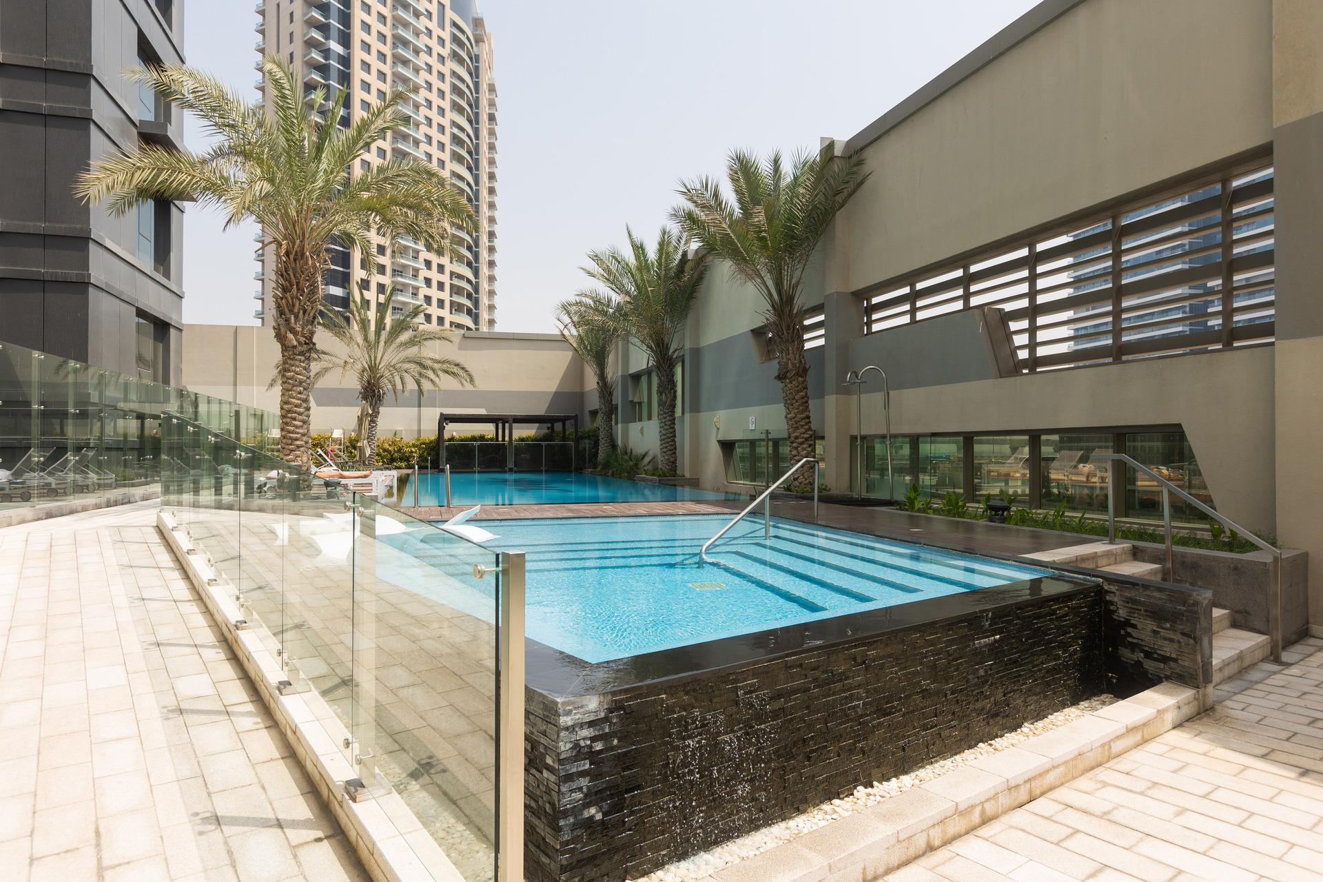 Photograph of the swimming pool area at InterCube hostel in Dubai.